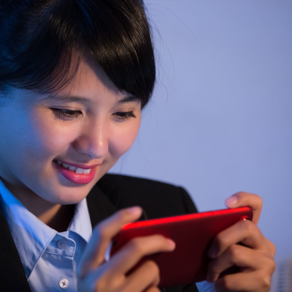 Businesswoman Play Mobile Game