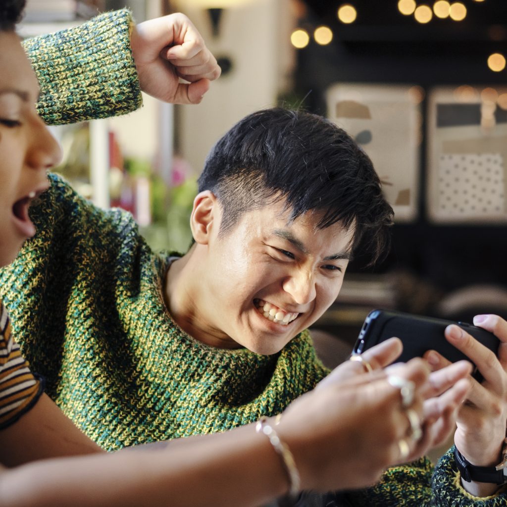 Couple playing online mobile game