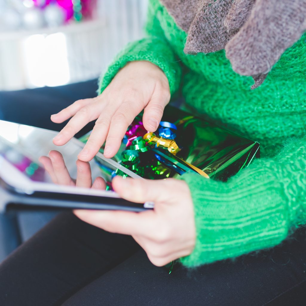 Close up woman using tablet xmas at home