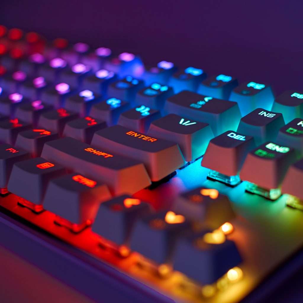 RGB gaming keyboard. Bright colorful keyboard, soft focus. Mechanical keyboard with RGB light, blurred background