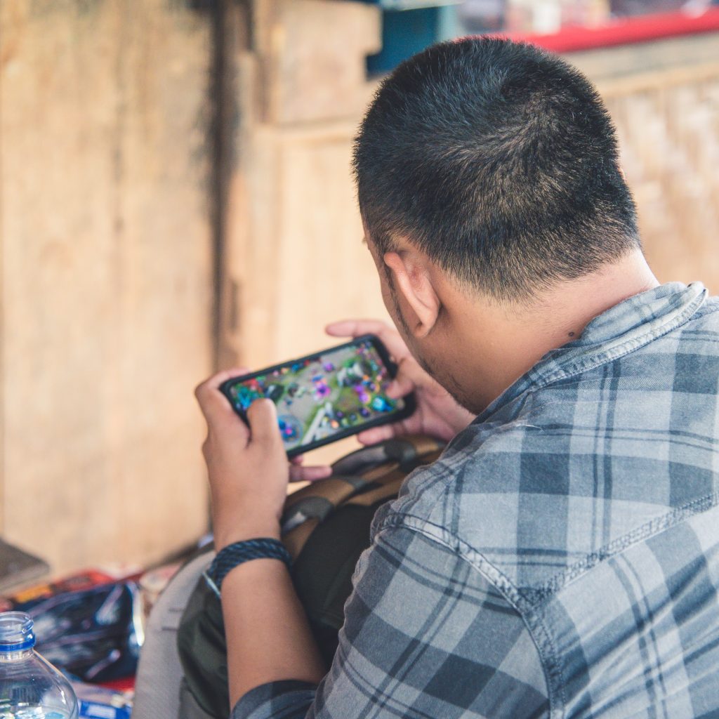 Busy Guy playing mobile game