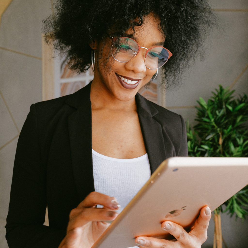 Woman In Black Blazer Holding An Ipad