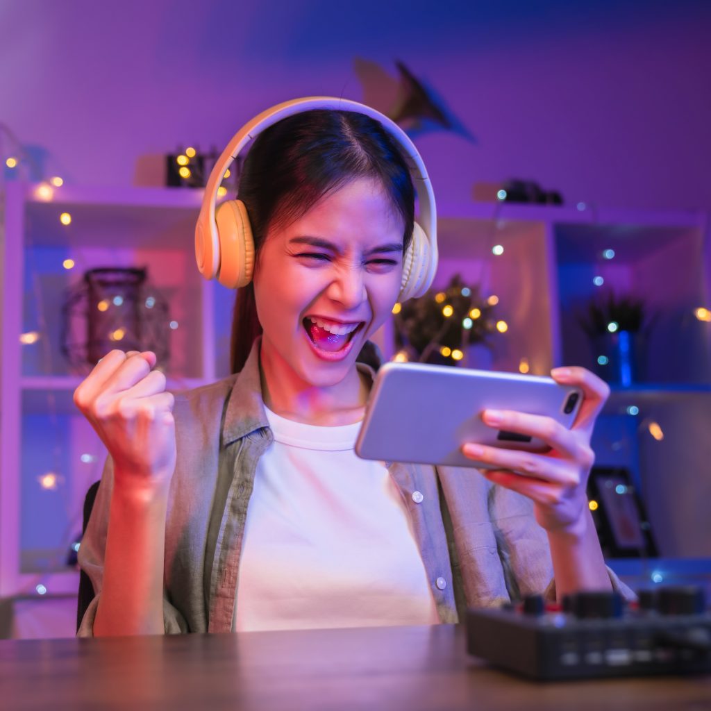 woman playing online game on smartphone